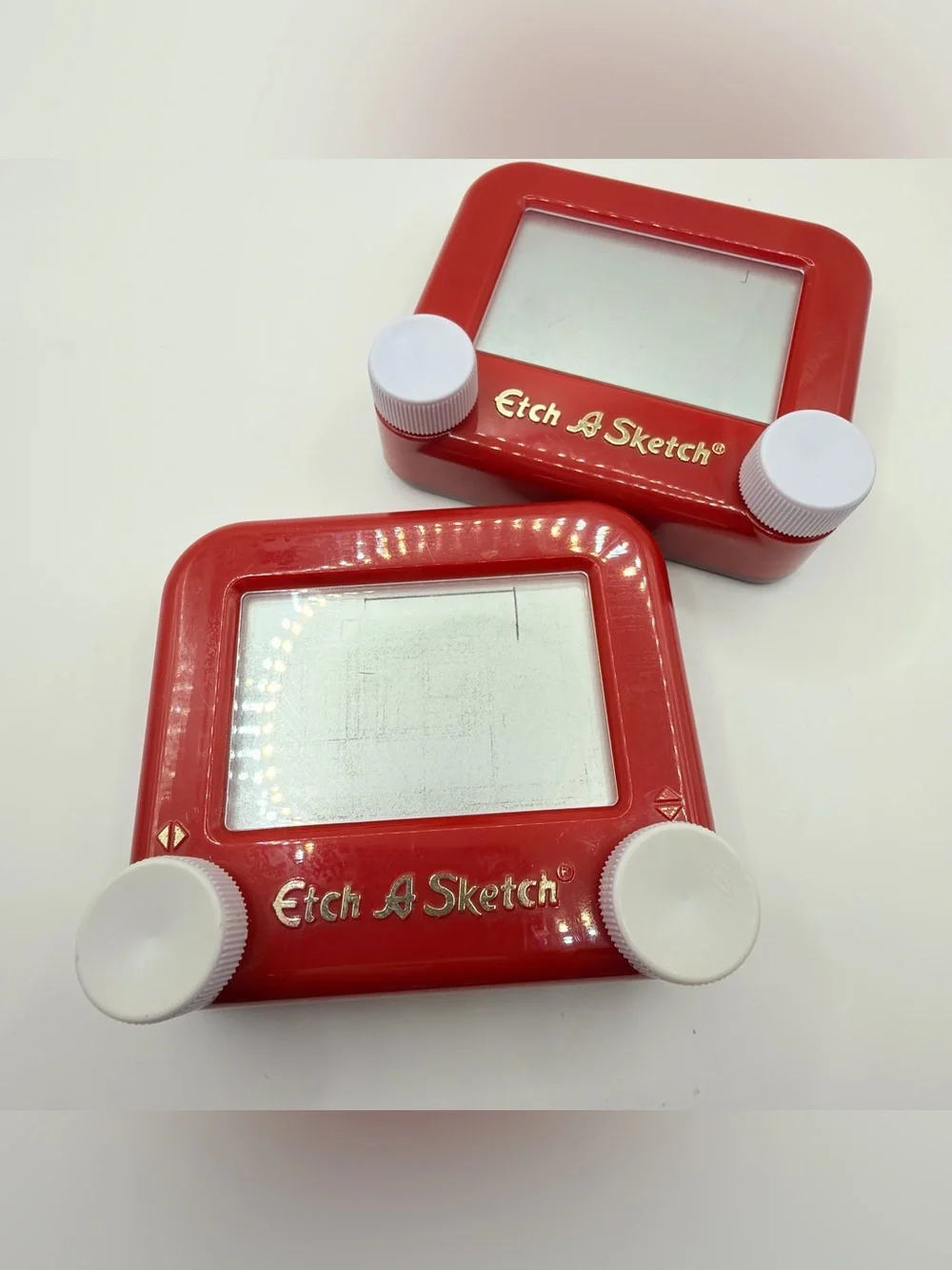 Pair of Mini Classic Red etch a Sketch toys
